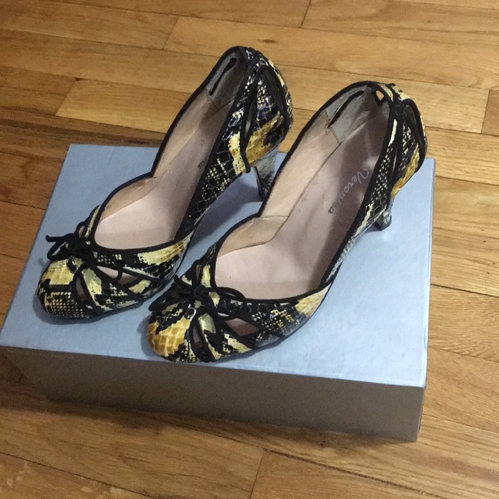 Gold and black snakeskin-like pumps. 51/2